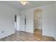 Bedroom featuring wood flooring and multiple doorways for easy navigation throughout the home at 3920 Smokey Fog Ave # 201, North Las Vegas, NV 89081