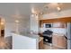 Bright kitchen featuring stainless appliances and a breakfast bar perfect for casual dining at 3920 Smokey Fog Ave # 201, North Las Vegas, NV 89081