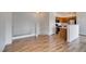 Spacious living area showcases hardwood floors, blending into the adjacent kitchen for seamless flow at 3920 Smokey Fog Ave # 201, North Las Vegas, NV 89081