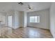 Bright living area featuring stylish floors, neutral walls, and access to a patio through sliding doors at 3920 Smokey Fog Ave # 201, North Las Vegas, NV 89081