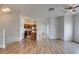 Open-concept design connecting the living room and kitchen, featuring hardwood floors and natural light at 3920 Smokey Fog Ave # 201, North Las Vegas, NV 89081