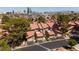Aerial view of the townhomes, showcasing the community layout, red tile roofs and city skyline at 3972 Tirana Way, Las Vegas, NV 89103