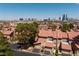 Overhead shot of the residences, highlighting the red rooftops, landscaping, and the cityscape backdrop at 3972 Tirana Way, Las Vegas, NV 89103
