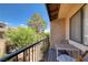 Relaxing balcony with seating overlooking lush greenery and neighborhood landscape at 3972 Tirana Way, Las Vegas, NV 89103