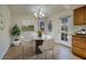 Cozy breakfast nook featuring a marble table and natural lighting at 3972 Tirana Way, Las Vegas, NV 89103