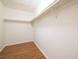 Spacious walk-in closet features hardwood floors and ample space for storage, with shelving at 3972 Tirana Way, Las Vegas, NV 89103