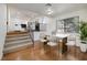 Dining area with wood floors, a modern light fixture, and a marble table at 3972 Tirana Way, Las Vegas, NV 89103