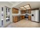Eat in kitchen featuring stainless steel appliances, tile floors and direct access to back patio at 3972 Tirana Way, Las Vegas, NV 89103