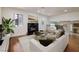 Bright living room featuring wood floors, a fireplace, and modern decor at 3972 Tirana Way, Las Vegas, NV 89103