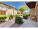 Beautiful patio surrounded by greenery, creating a peaceful and inviting outdoor space at 3972 Tirana Way, Las Vegas, NV 89103