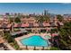 Aerial view of the pool, hot tub, landscaping and community featuring a Las Vegas skyline at 3972 Tirana Way, Las Vegas, NV 89103