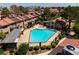 Community swimming pool with jacuzzi and lounge area, surrounded by trees and residential buildings at 3972 Tirana Way, Las Vegas, NV 89103