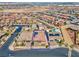 Aerial shot showcasing the property, surrounded by a well-planned community with picturesque desert landscaping and paved streets at 398 Frank Case Ln, Henderson, NV 89011