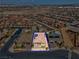 Expansive aerial view of a residential area, displaying well-maintained homes, landscaping, and a neatly planned community at 398 Frank Case Ln, Henderson, NV 89011