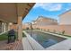 Home featuring a sparkling rectangular pool, artificial grass and covered patio at 398 Frank Case Ln, Henderson, NV 89011