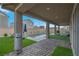 Inviting covered patio with a rectangular pool and artificial grass at 398 Frank Case Ln, Henderson, NV 89011