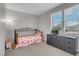 Charming bedroom with a comfy bed, dresser, and natural light from the window at 398 Frank Case Ln, Henderson, NV 89011
