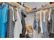 Walk-in closet with organized hanging clothes and shelf storage at 398 Frank Case Ln, Henderson, NV 89011
