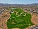 Beautiful aerial view of community park including green space, walking paths, playground and splash pad at 398 Frank Case Ln, Henderson, NV 89011