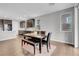 Bright dining area features dark wood cabinets, a marble table and bench seating at 398 Frank Case Ln, Henderson, NV 89011