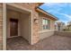 Close-up of the front entryway featuring stone accents, a covered porch, and a decorative front door at 398 Frank Case Ln, Henderson, NV 89011