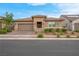 Charming single-story home showcasing a desert-landscaped yard and a two-car garage at 398 Frank Case Ln, Henderson, NV 89011