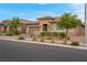 Beautiful single-story house with a well-maintained lawn and an attached two-car garage at 398 Frank Case Ln, Henderson, NV 89011
