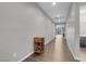 Long hallway with hardwood floors, connecting to various rooms in the house at 398 Frank Case Ln, Henderson, NV 89011