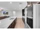 Well-lit kitchen with a large white countertop island and stainless steel appliances at 398 Frank Case Ln, Henderson, NV 89011