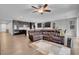 Open-concept living room and kitchen area, featuring hardwood floors and comfortable seating at 398 Frank Case Ln, Henderson, NV 89011