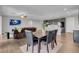 Open concept living room and kitchen area, with dark wood cabinets and floors at 398 Frank Case Ln, Henderson, NV 89011