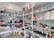 Walk-in pantry with extensive shelving for ample storage space at 398 Frank Case Ln, Henderson, NV 89011