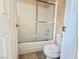 Full bathroom featuring a shower over tub with sliding glass doors at 4013 Extenso Dr, North Las Vegas, NV 89032