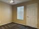 A modest bedroom featuring neutral walls, ceiling fan, brown carpet and a window with white blinds at 4013 Extenso Dr, North Las Vegas, NV 89032
