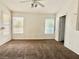 Bedroom with neutral carpet, window with blinds, and neutral-colored walls at 4013 Extenso Dr, North Las Vegas, NV 89032