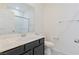 Well-lit bathroom features a modern vanity, white toilet, and tiled floors for easy maintenance at 4566 Mansart Ct # 1104, North Las Vegas, NV 89031