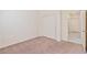 Comfortable bedroom with sliding closet doors, plush carpet, and access to the hallway at 4566 Mansart Ct # 1104, North Las Vegas, NV 89031