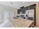 Open kitchen featuring an island, stainless steel appliances, and modern design at 4566 Mansart Ct # 1104, North Las Vegas, NV 89031