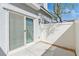 Private patio with white fence and sliding glass door access to the home's interior at 4566 Mansart Ct # 1104, North Las Vegas, NV 89031