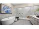 Elegant bathroom featuring a standalone tub, walk-in shower, and modern vanity at 489 Carter House Way, Las Vegas, NV 89138