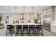 Spacious kitchen island with pendant lights, bar seating, and stainless steel appliances in this well-appointed kitchen at 489 Carter House Way, Las Vegas, NV 89138