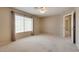 Large bedroom with carpet, a window and an open doorway at 500 Quail Bird Pl, Henderson, NV 89052