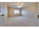 The bedroom features neutral walls, a ceiling fan, and natural light at 500 Quail Bird Pl, Henderson, NV 89052