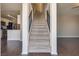Entryway features an open staircase and views into the kitchen and living room at 500 Quail Bird Pl, Henderson, NV 89052