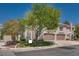 Spacious two-story home featuring a two-car garage and mature landscaping at 500 Quail Bird Pl, Henderson, NV 89052
