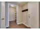 Hallway featuring storage area and coat hooks, leading to the home entrance at 500 Quail Bird Pl, Henderson, NV 89052