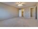 The spacious bedroom features neutral walls, a ceiling fan, and connecting rooms at 500 Quail Bird Pl, Henderson, NV 89052