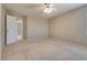 Spacious bedroom featuring neutral walls, a ceiling fan, and connecting rooms at 500 Quail Bird Pl, Henderson, NV 89052