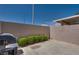 Private patio area with a grill and privacy wall, perfect for outdoor entertaining at 500 Quail Bird Pl, Henderson, NV 89052