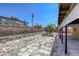 The backyard features a spacious patio area with an outdoor fireplace at 5132 Springland St, Las Vegas, NV 89146